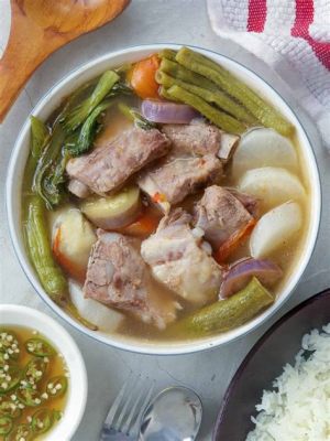  Sinigang na Baboy! Un plato de cerdo Filipino con un irresistible contraste de sabores agrios y umami.