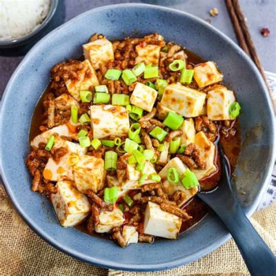  ¿Con qué picante se prepara la Mapo Tofu y cómo alcanza la textura cremosa perfecta?